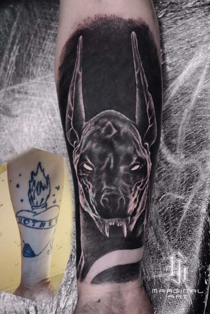 We painted over scary tattoos with Anubis